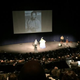 A photo of a younger Michel du Cille is projected before an audience of about 500 at the memorial service for the photojournalist Friday at the Newseum in Washington, D.C.
Newseum